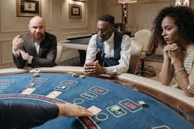 Live casino blackjack table with dealer and digital interface